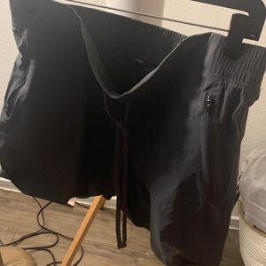 Green  Drawstring Shorts waist 18 inches Length 15 zipper pockets.